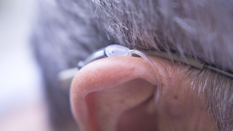 hearing aid close on person