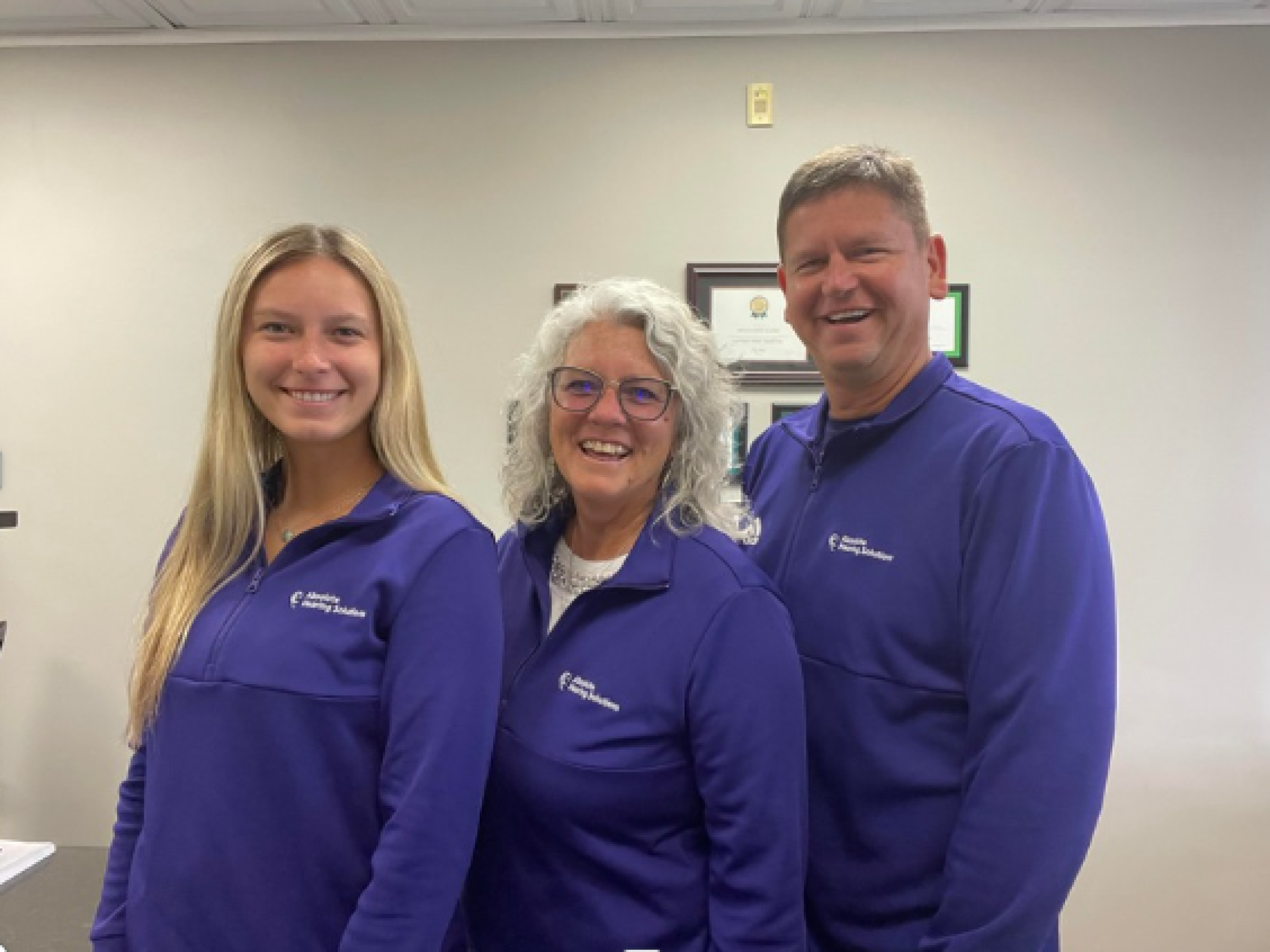 Team at Absolute Hearing Solutions helping patients with hearing aid coverage in Columbus Ohio