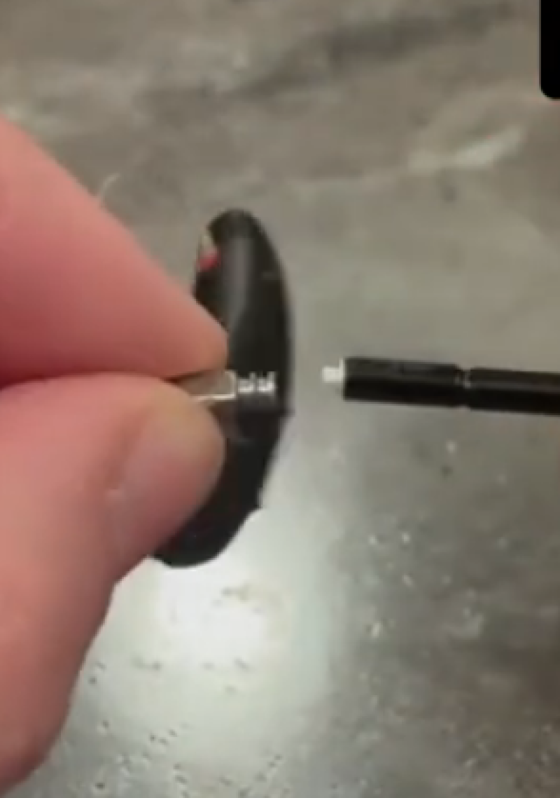Inserting new Signia Wax Guard Filter into the hearing aid