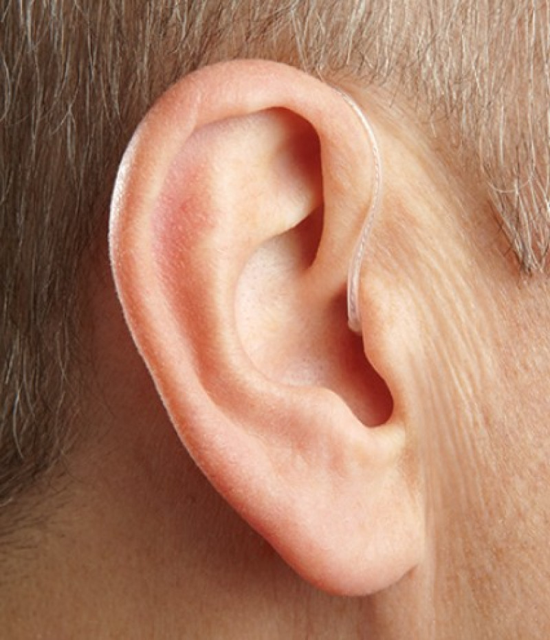 RIC hearing aid worn behind the ear with slim wire and discreet fit